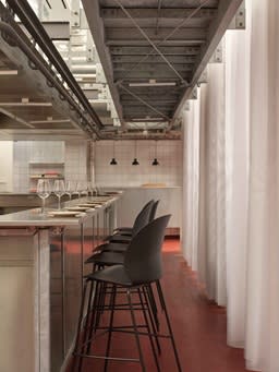 Row of blue chairs at a bar-height counter